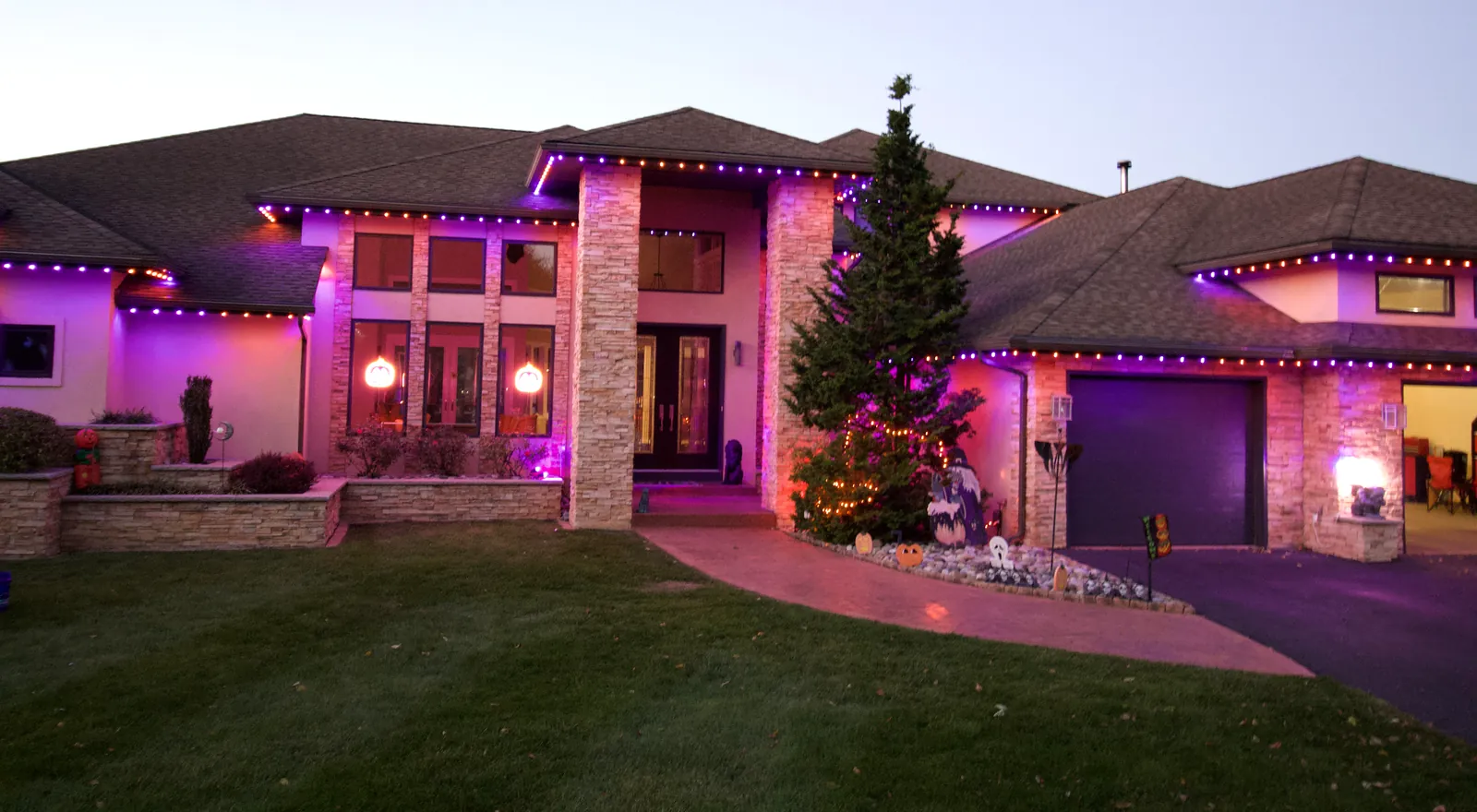 Lehigh Valley home with permanent Trimlight lights in purple and orange for Halloween